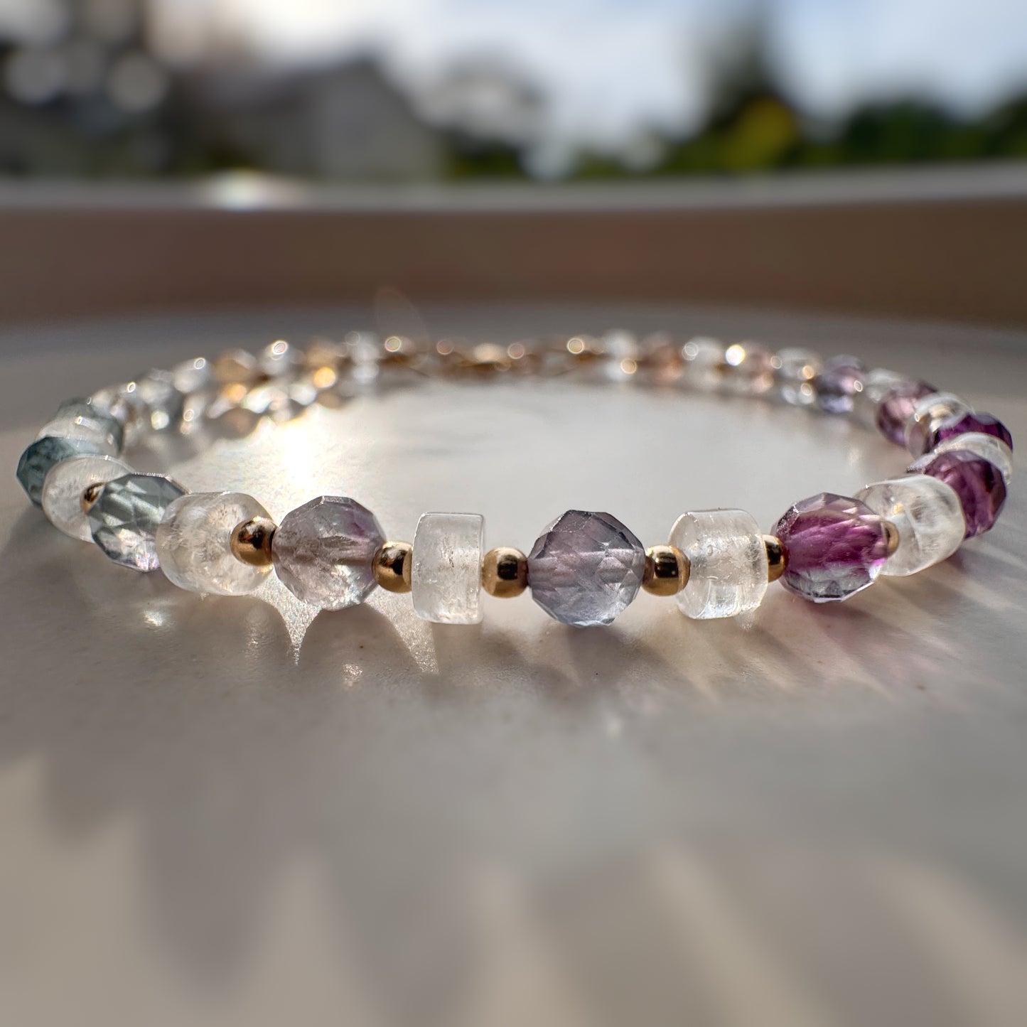 rainbow beaded bracelet in sunlight